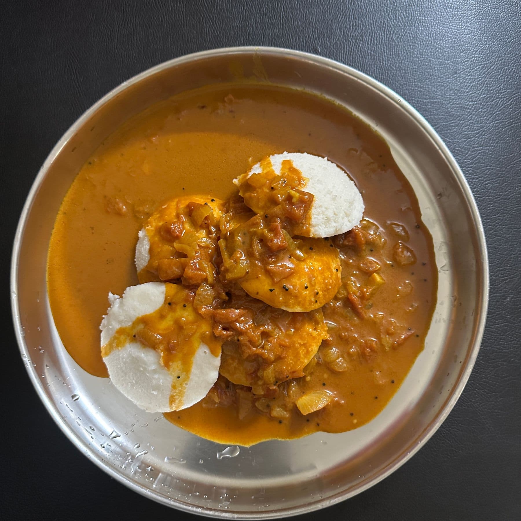 Steamed idli with sambar and coconut chutney